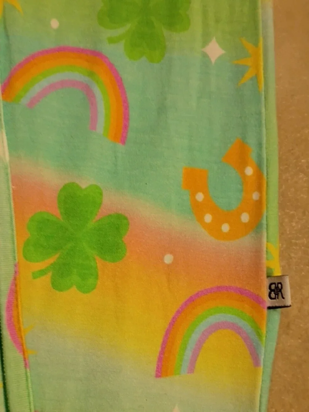 Bums And Roses 2t Footed One-Piece with Rainbow & Clover Print